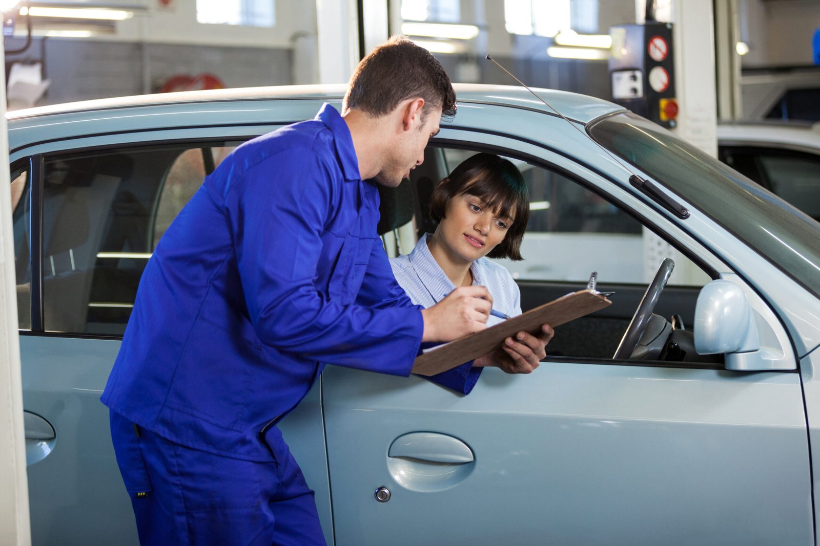 Home mechanic showing the quotation to a customer